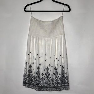 Cream strapless shirred tunic top w/black design